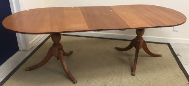 A modern mahogany D end twin pillared dining table in the Regency style 91 cm wide x 227 cm long