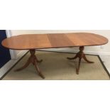 A modern mahogany D end twin pillared dining table in the Regency style 91 cm wide x 227 cm long