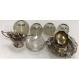 A collection of silver wares to include four silver mounted ribbed glass match strikers,