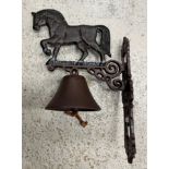 A painted cast iron "Heavy Horse" wall mounted bell