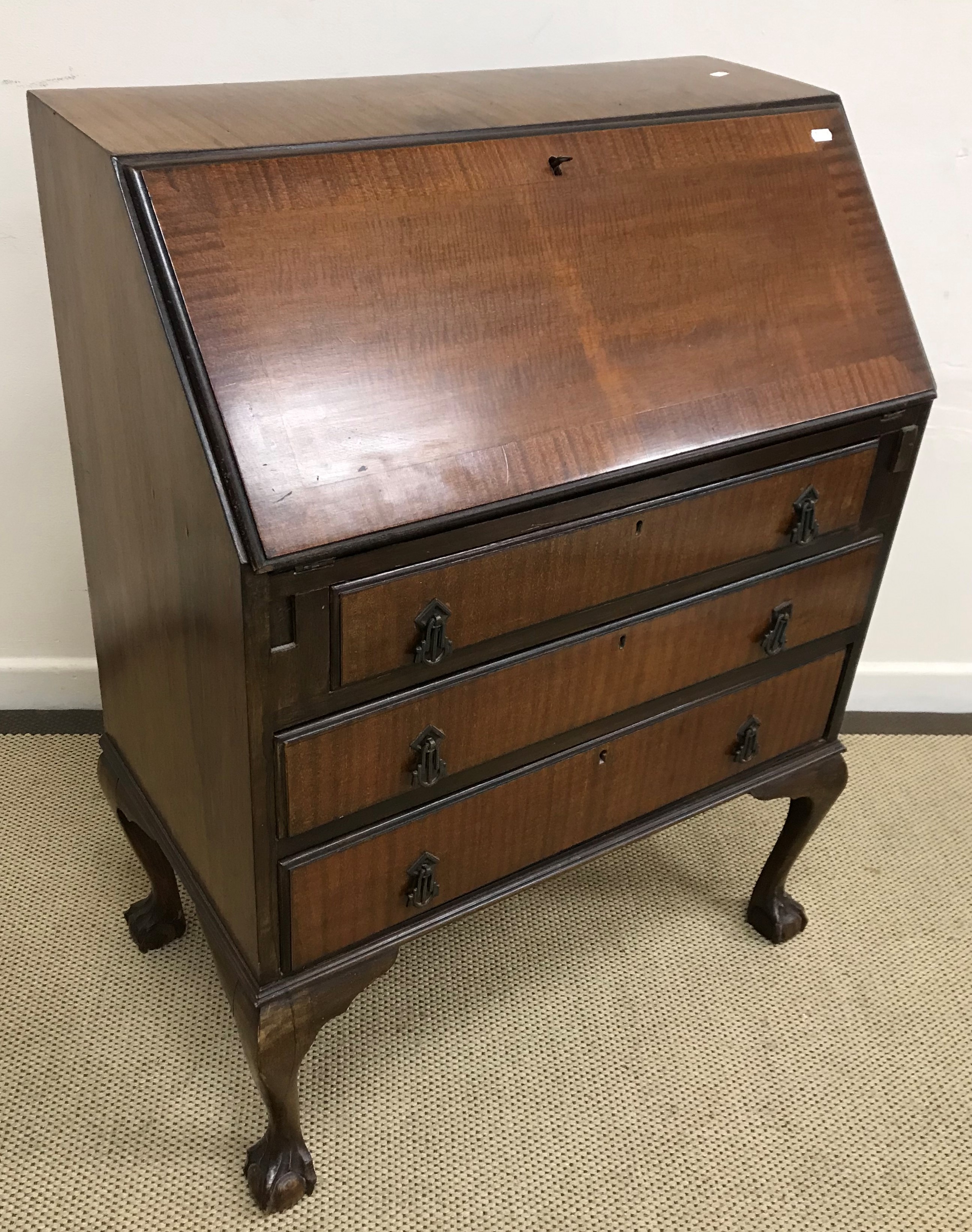 A mid 20th Century mahogany and cross-banded bureau,