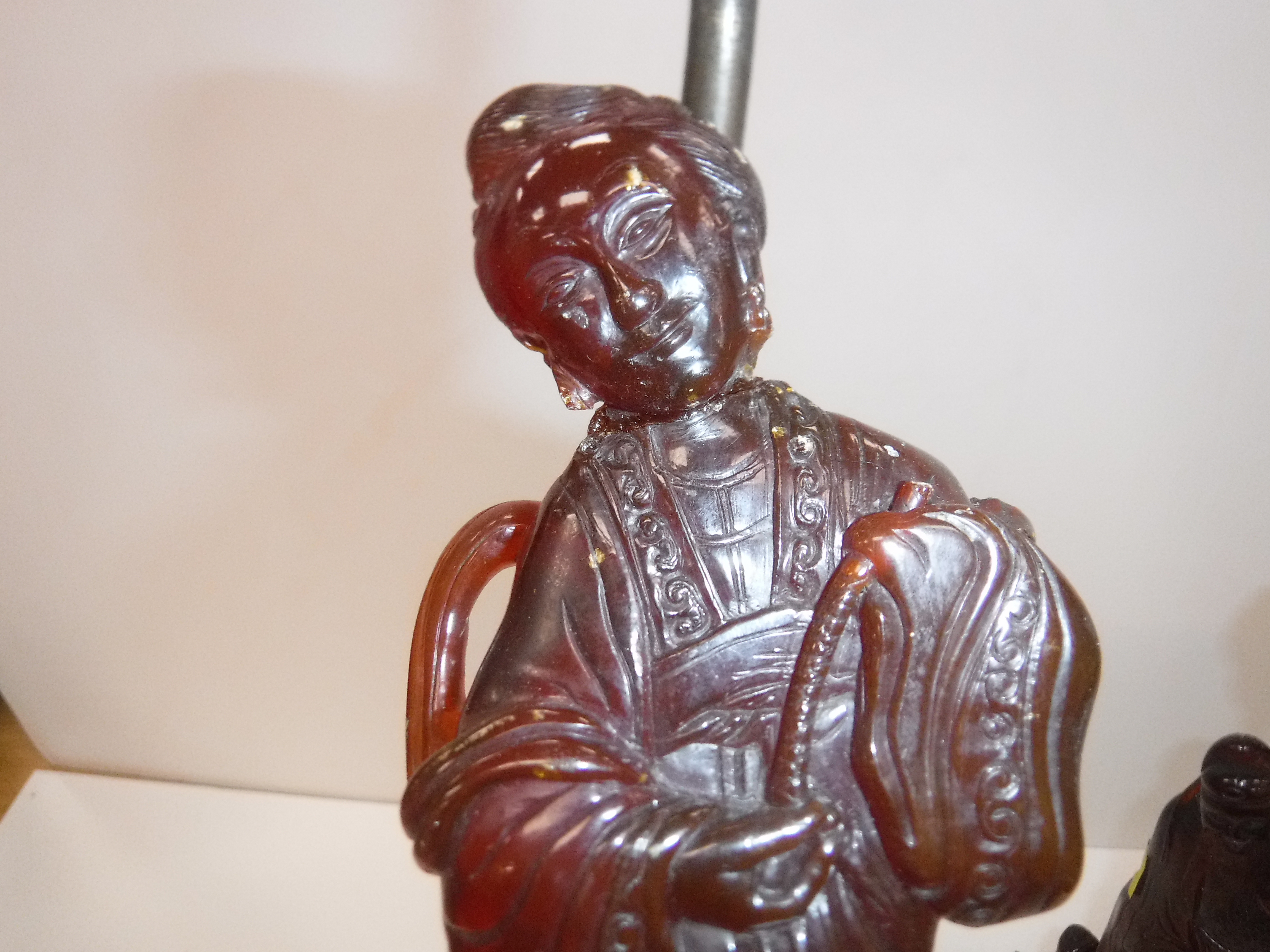 A pair of Chinese carved amber figures of a man and a woman in robes, - Image 17 of 27