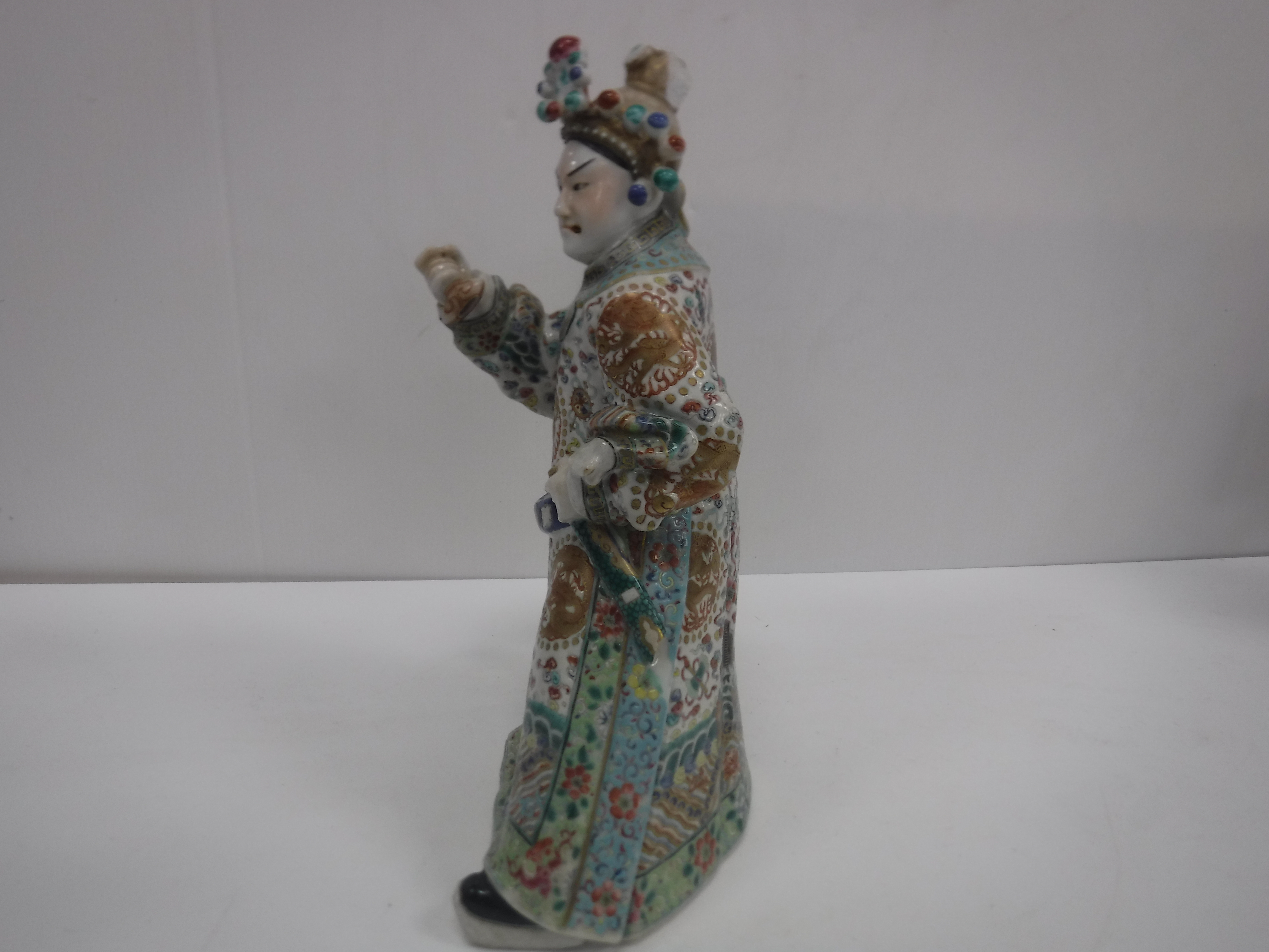 A set of three 19th Century Chinese polychrome decorated figures, one seated, one bearing sword, - Image 21 of 37
