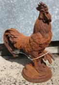 A cast metal figure of a cockerel, with