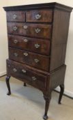 An early 18th Century walnut chest on st