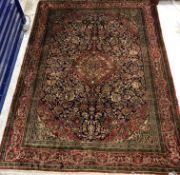 A fine Kashan silk rug, the central pane