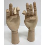 Two wooden artist's model hands, with jo