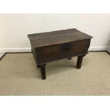 An 18th Century oak box, the two plank top with moulded edge over plain front and sides,