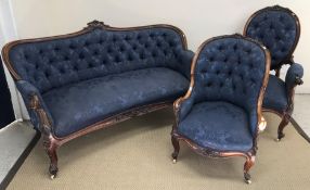 A Victorian salon suite comprising settee and lady's and gentleman's armchairs,