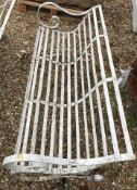 A Victorian wrought iron slatted garden bench seat, together with another as a pair,