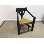 An oak corner chair in the 17th Century manner,