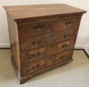 An 18th Century walnut chest,