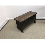 An 18th Century oak coffer of small proportions, the plain top with moulded front edge,