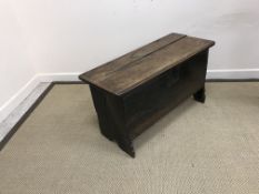 An 18th Century oak coffer of small proportions, the plain top with moulded front edge,