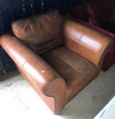 A modern brown leather upholstered scroll arm chair 104 cm wide x 95 cm deep x 72 cm high and