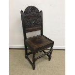 A 17th Century and later carved oak chair, the back with foliate oak leaf and acorn decoration,