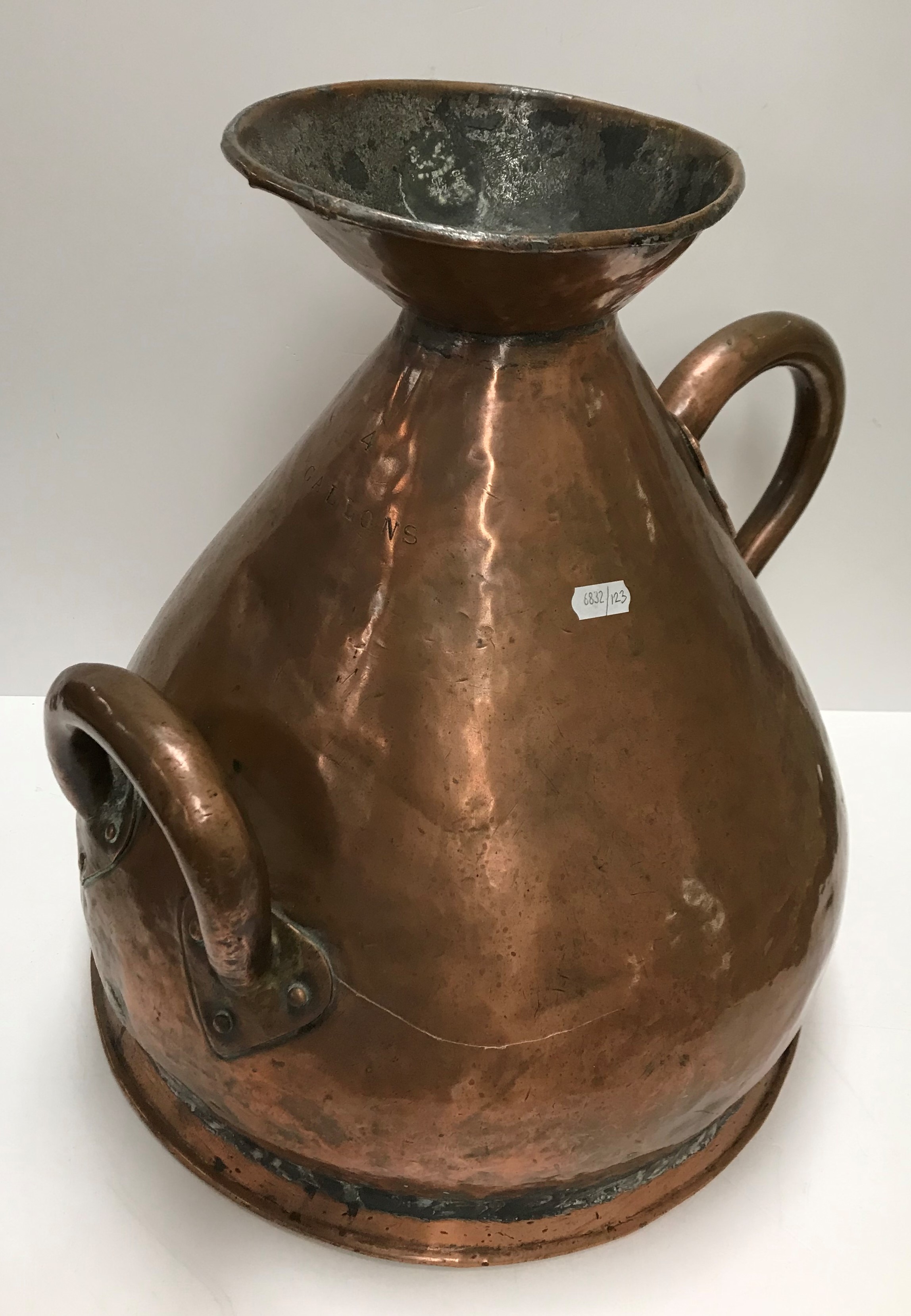 A 19th Century copper four gallon haystack measure 41 cm high together with a similar two gallon