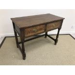 A 20th Century oak two drawer side table in the 18th Century manner,