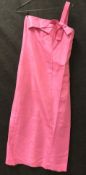 A pink silk type strapless gown with boned bodice and cross over front,