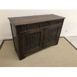 A 20th Century carved oak dresser in the 17th Century style,