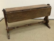 A 19th Century mahogany ship's drop-leaf table with brass mounts,