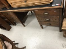 A mid 20th Century oak double pedestal desk,
