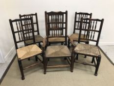 A composite set of five 18th / 19th Century spindle back rush seat chairs in the North Country