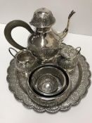 A Middle Eastern white metal coffee set on tray comprising coffee pot,