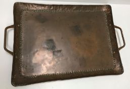 A Newlyn School copper rectangular tray by John Pearson with embossed dot decoration to the edges