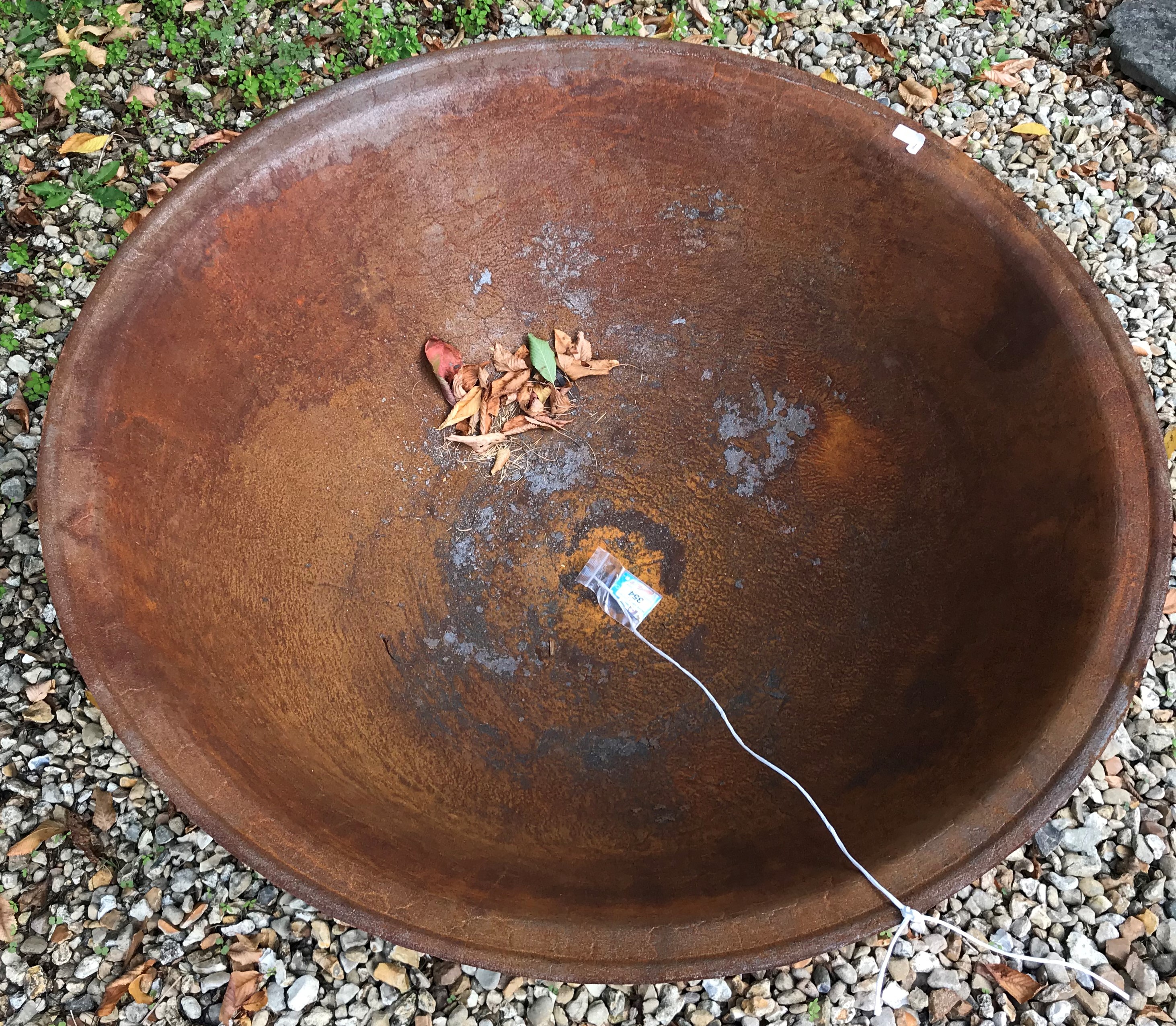 A cast iron fire pit with rust patination, - Image 2 of 3