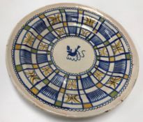 A 19th Century tin glazed Delft ware plate,