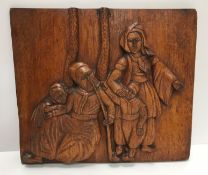 An 18th Century Continental oak and carved panel with central figural bust medallion amongst