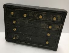 A 19th Century Welsh vernacular slate model of a chest of two short over three long drawers,