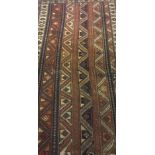 A Kazak rug, the central panel set with