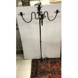 A wrought iron four branch five light ca