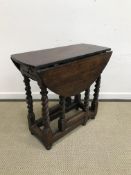 An 18th Century oak oval gate-leg drop-l