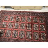 A modern Frith Rugs Bokhara rug, the cen