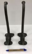 Two modern cast metal coat hooks inscrib