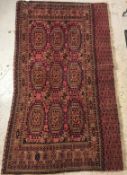 A vintage Bokhara rug, the central panel