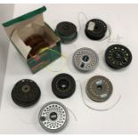 A collection of various fly reels includ