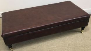 A modern brown leather upholstered drawi