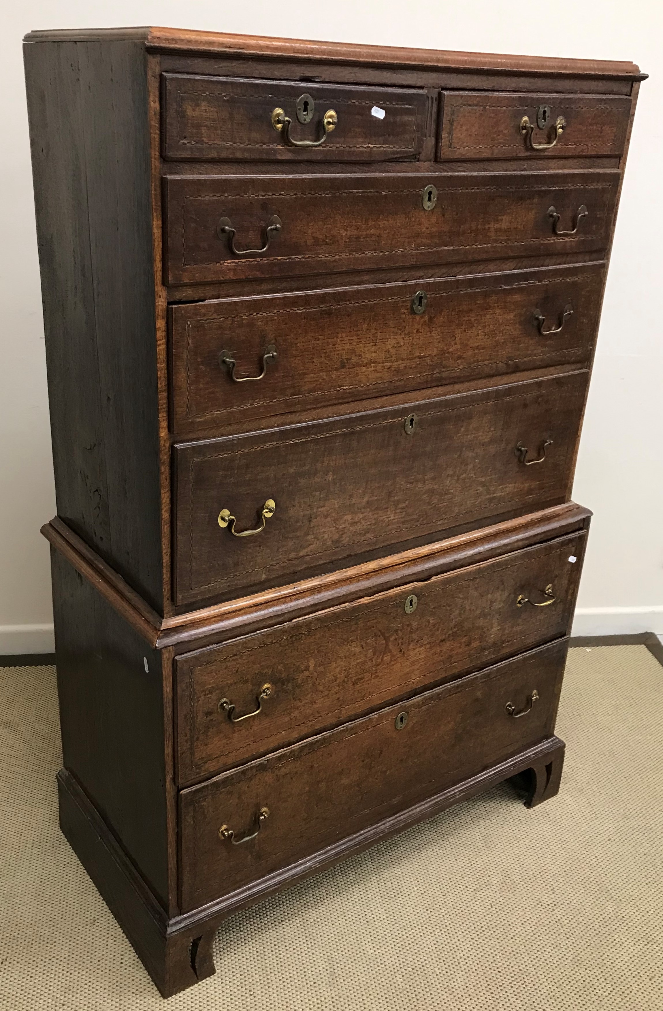 An early 19th Century oak chest on chest