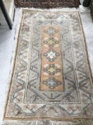 A Caucasian rug, the central panel set w