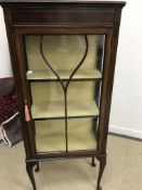An Edwardian mahogany and inlaid display