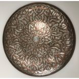 A Middle Eastern Islamic copper and whit