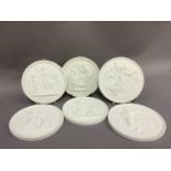 A set of six Royal Copenhagen parian ware wall plaques, circular moulded in relief with classical