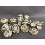 A quantity of Hammersley china printed and enamelled with flowers, gilt feathering to the rims, in