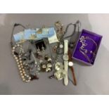 A small collection of late 20th century costume jewellery including necklaces and ladies