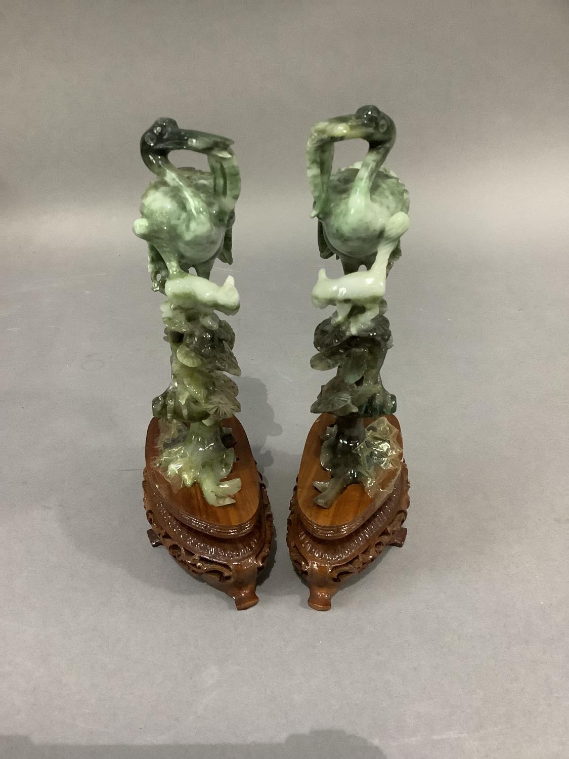 A pair of Chinese polished hardstone figures of an egret and cat in the branches of a pine tree, - Image 4 of 4