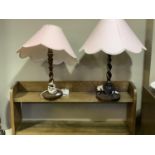 Two oak barley twist table lamps on circular bases together with a set of oak open book shelves